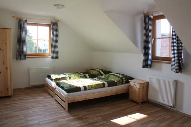 Slunná ložnice podkrovního apartmánu